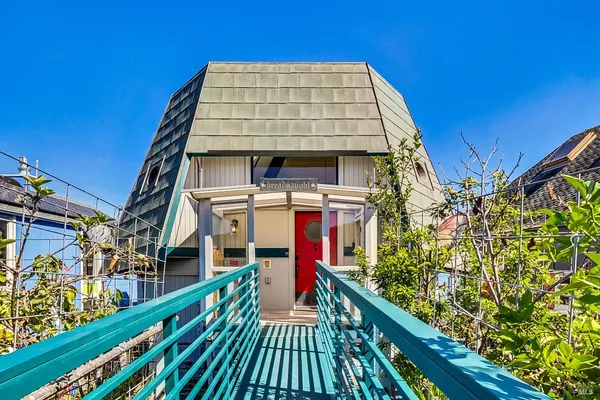 a view of a living room and dining room with furniture