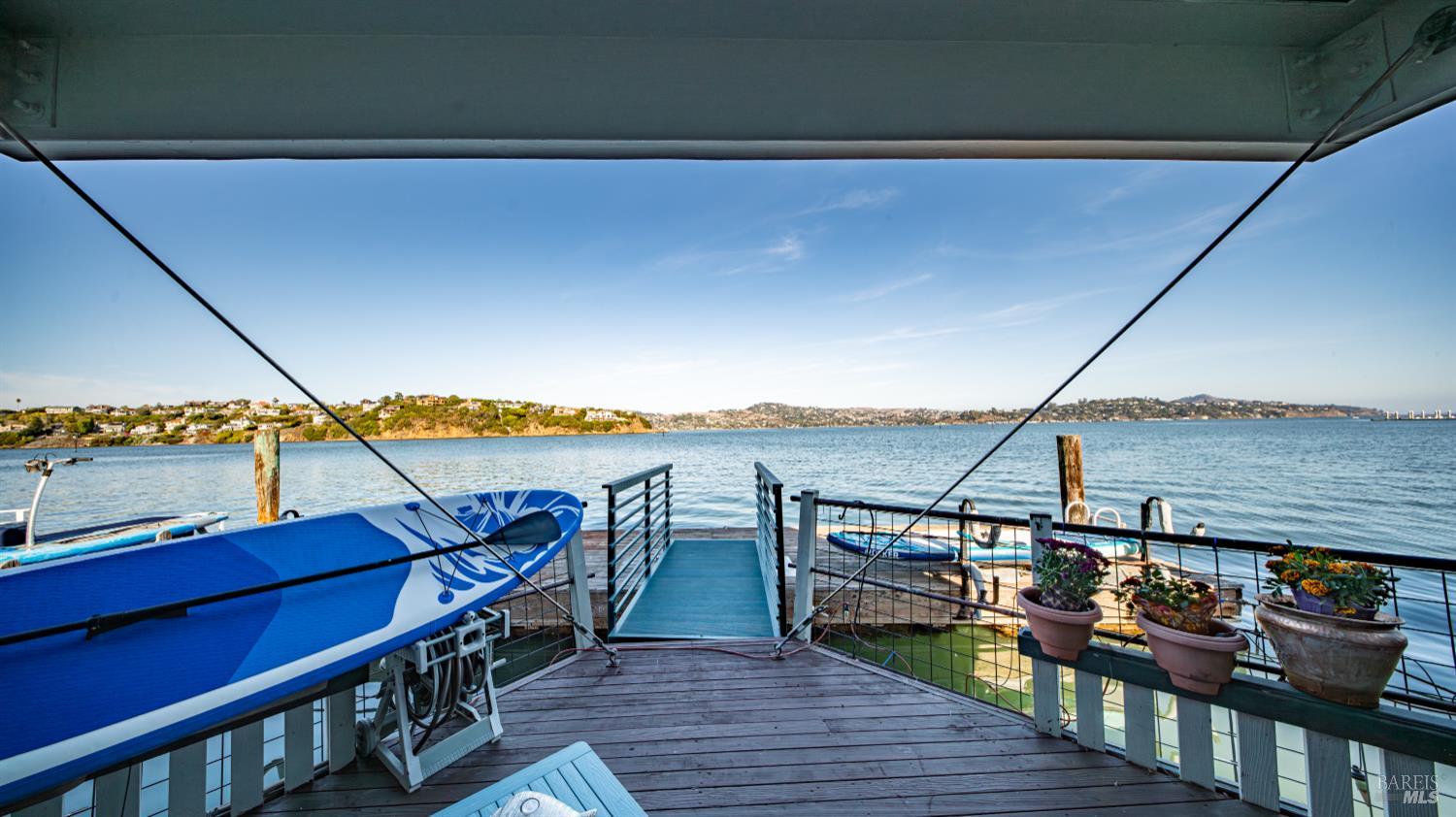 68 Issaquah Dock Sausalito, CA 94965 - Photo 19 of 81 a view of a balcony with chairs and wooden floor