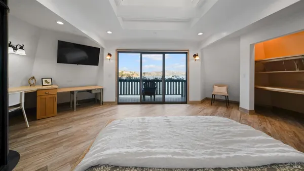 a living room with furniture a rug and a flat screen tv