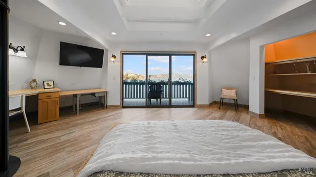 a living room with furniture a rug and a flat screen tv