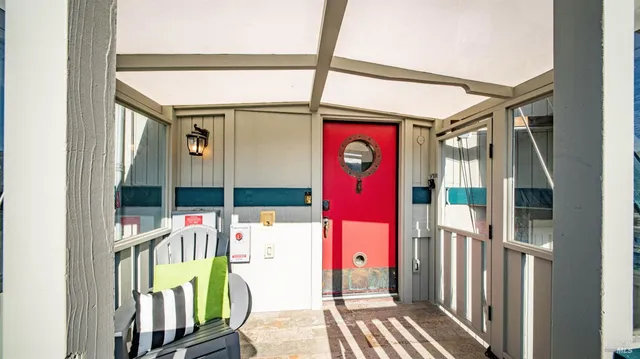 a kitchen with a sink and chairs