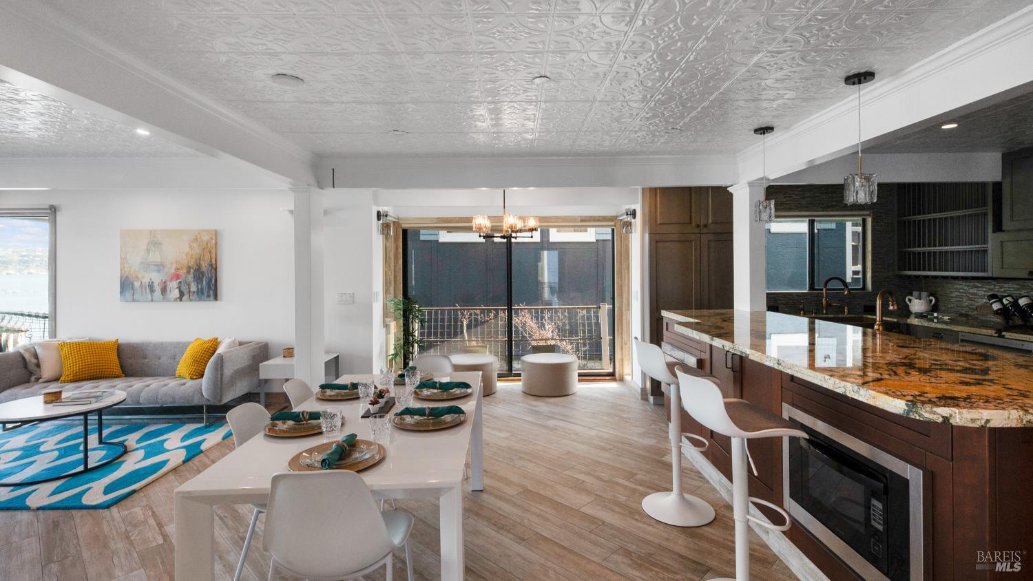 68 Issaquah Dock Sausalito, CA 94965 - Photo 34 of 81 a living room with furniture a rug and a flat screen tv