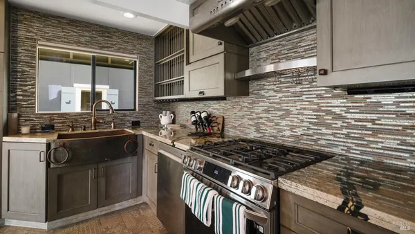 a view of a hallway with wooden floor and closet