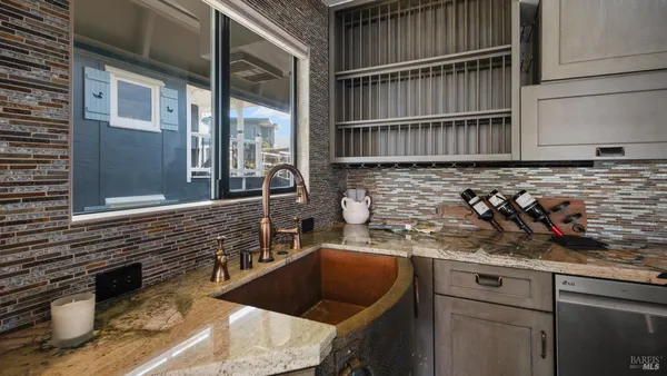 a bedroom with a bed and a chair