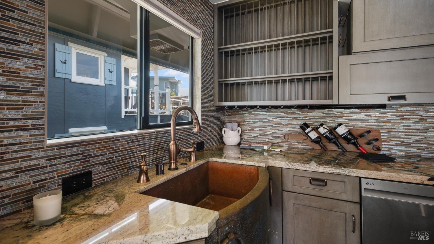 68 Issaquah Dock Sausalito, CA 94965 - Photo 39 of 81 a kitchen with a sink and cabinets
