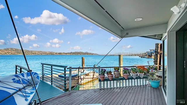 a view of a dining room with furniture wooden floor and chandelier