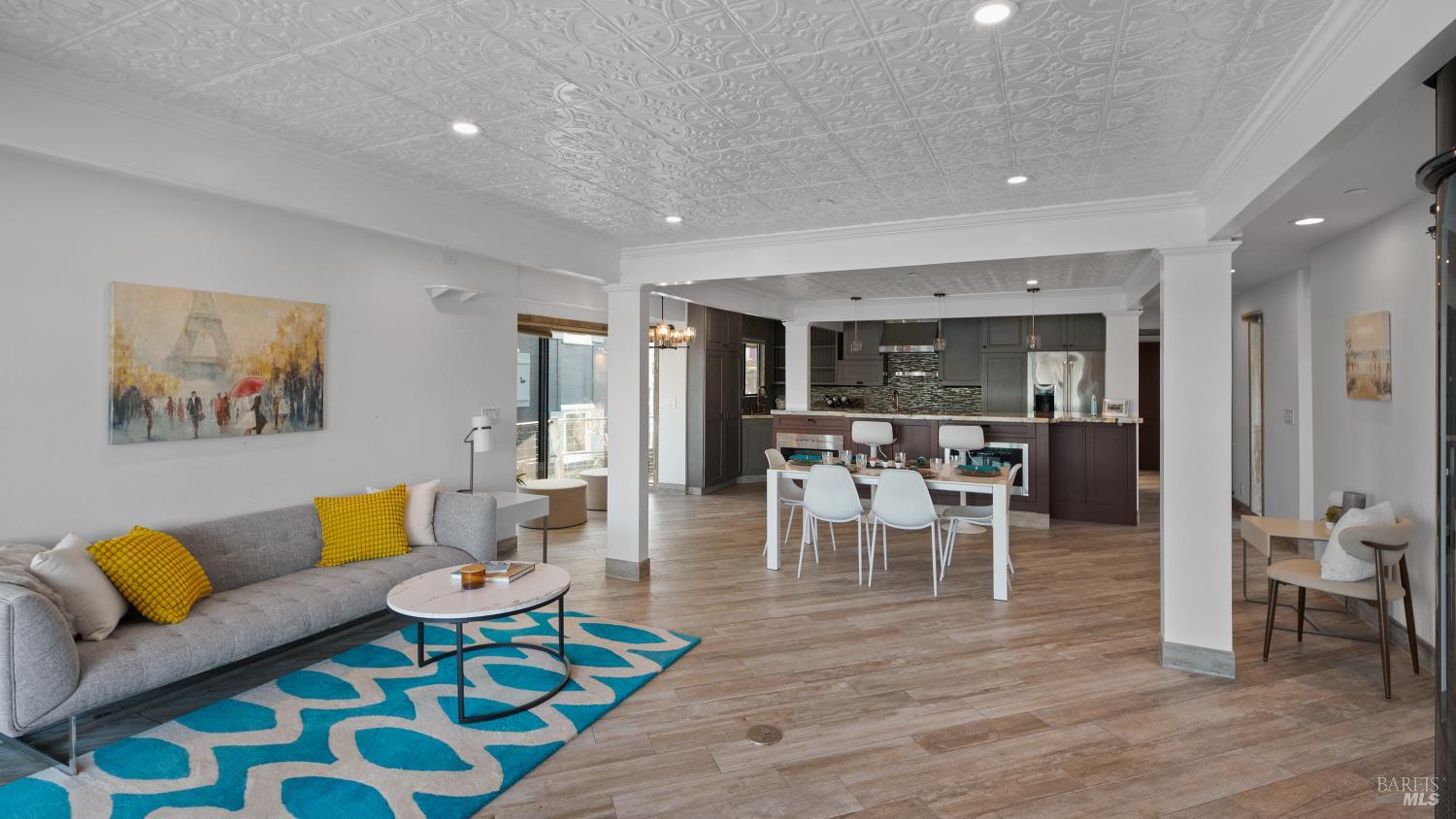 68 Issaquah Dock Sausalito, CA 94965 - Photo 41 of 81 a living room with furniture and a dining table with wooden floor