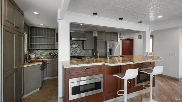 a spacious bathroom with a double vanity sink a mirror and a shower