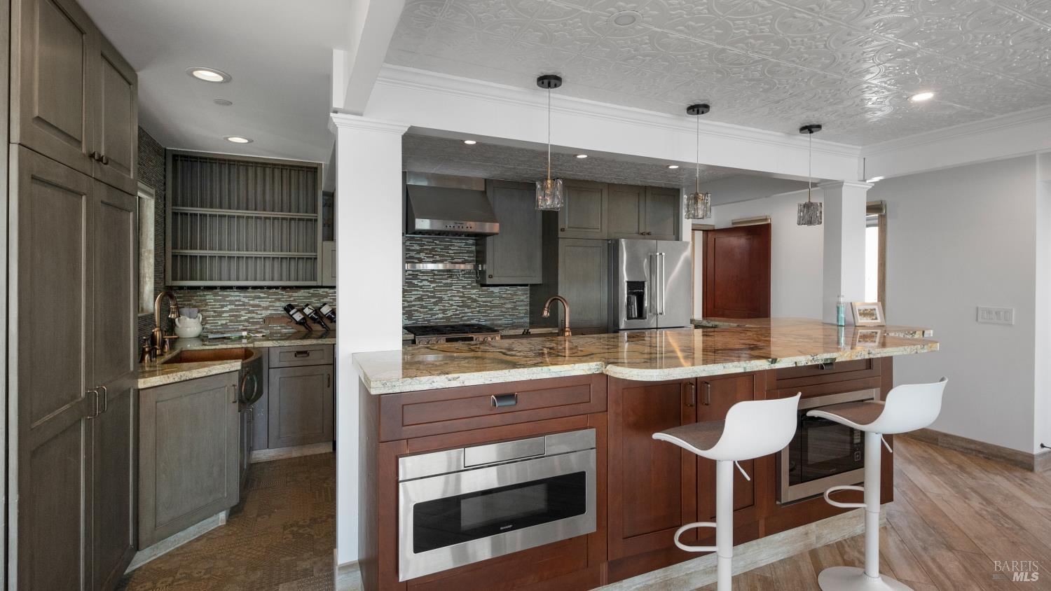 68 Issaquah Dock Sausalito, CA 94965 - Photo 43 of 81 a kitchen with a sink and chairs