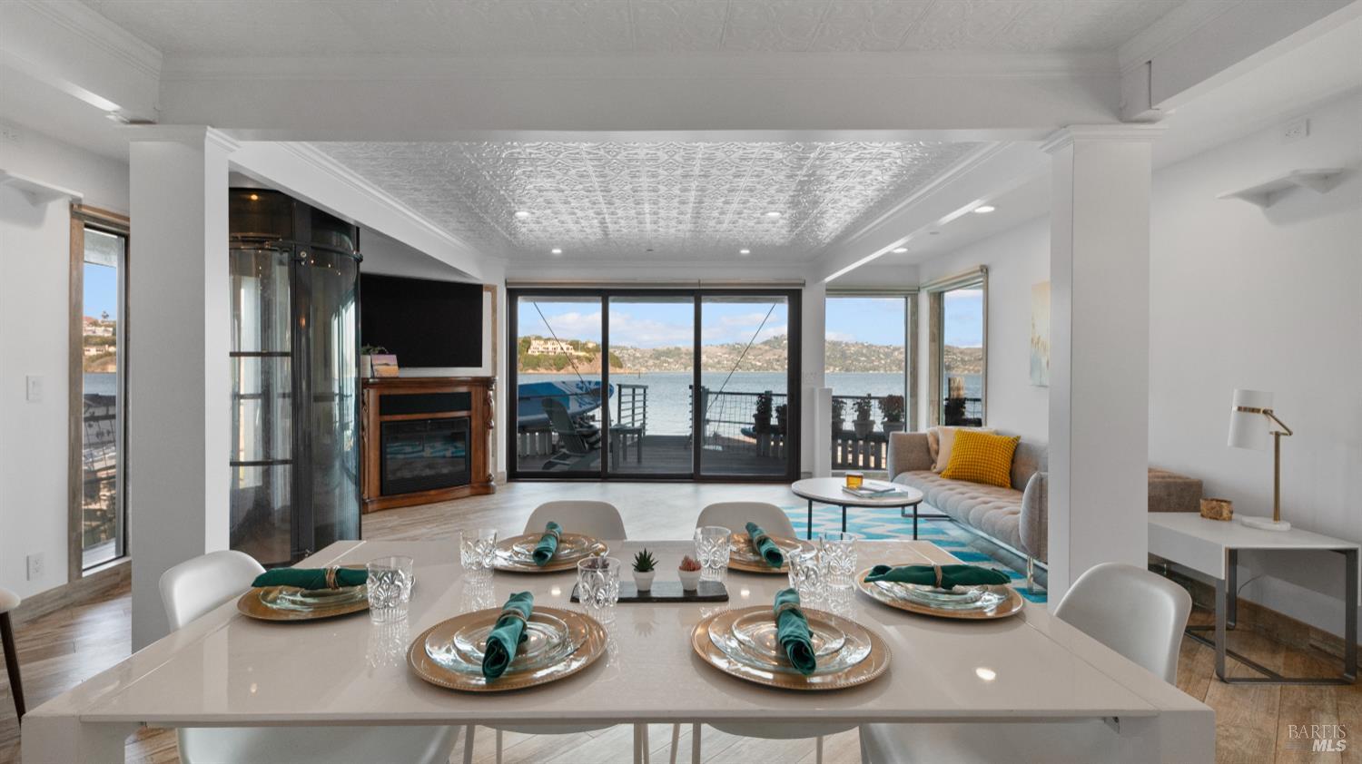 68 Issaquah Dock Sausalito, CA 94965 - Photo 49 of 81 a living room with furniture kitchen view and large windows
