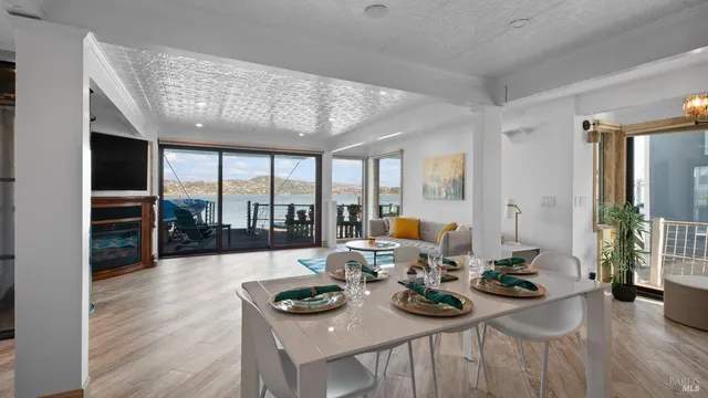 a view of a dining room with furniture window and wooden floor
