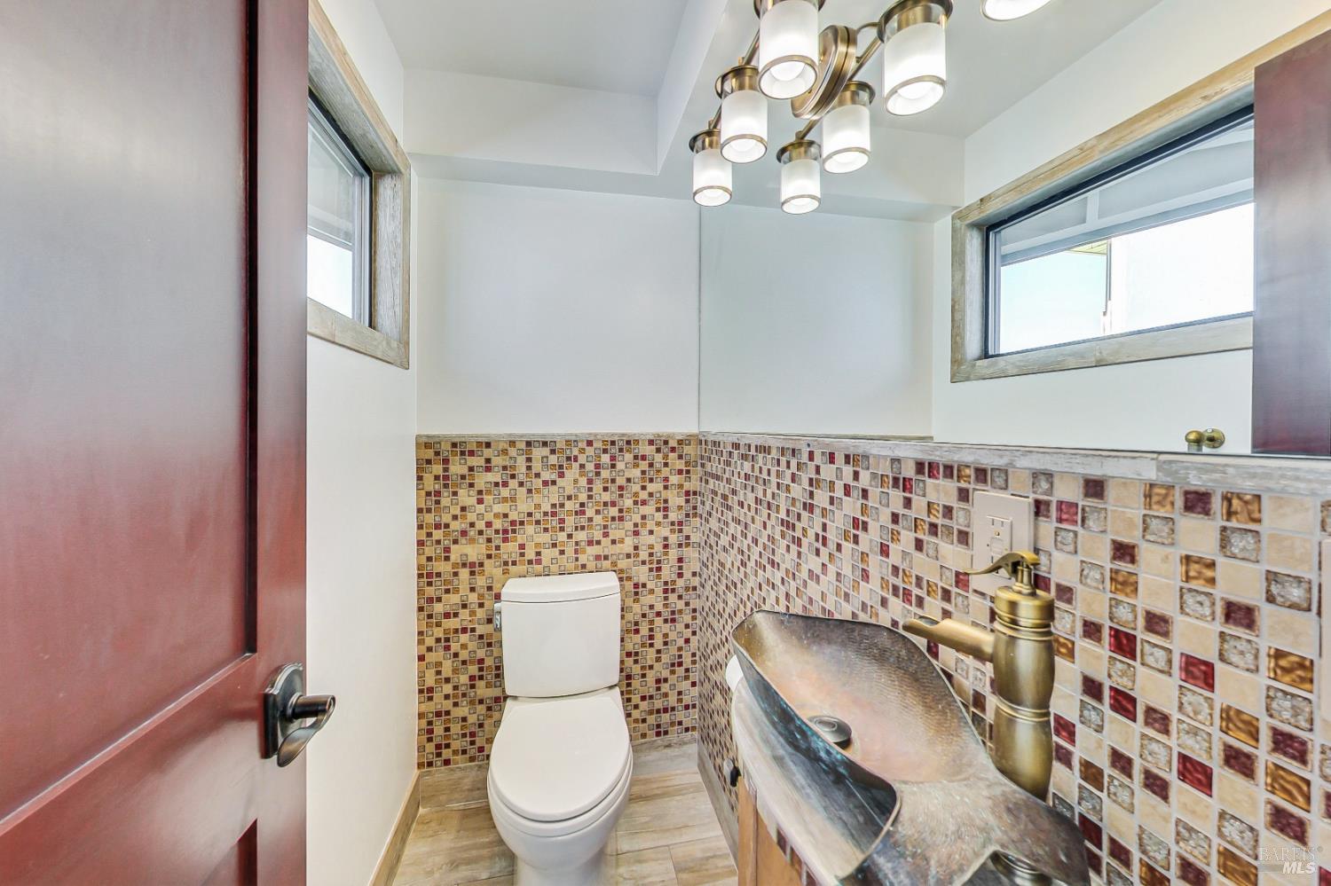 68 Issaquah Dock Sausalito, CA 94965 - Photo 8 of 81 a white toilet sitting next to a bathroom sink