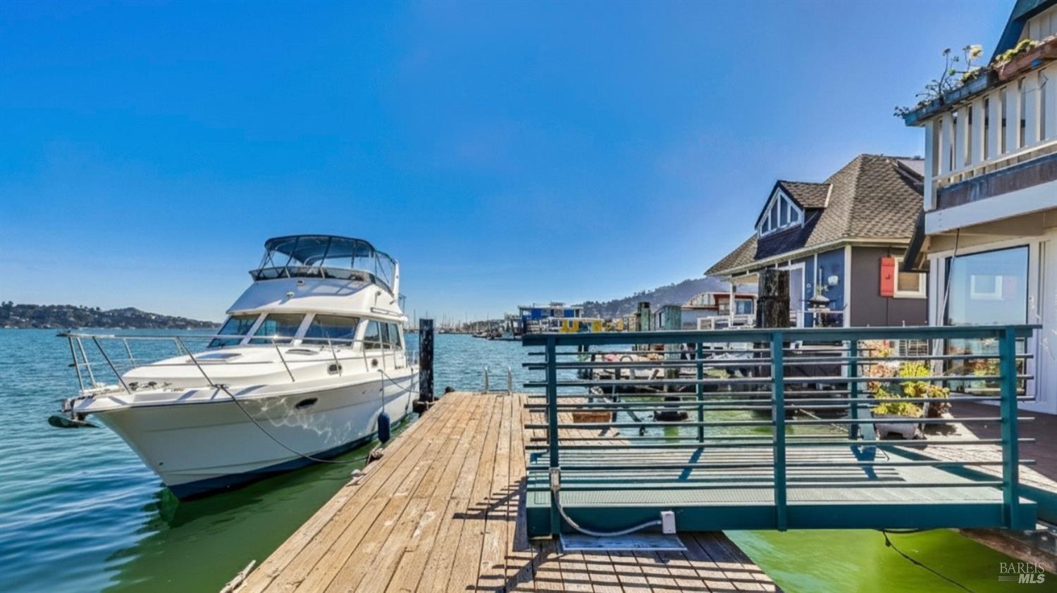 68 Issaquah Dock Sausalito, CA 94965 - Photo 10 of 81 a view of a roof deck with couches chairs and wooden floor