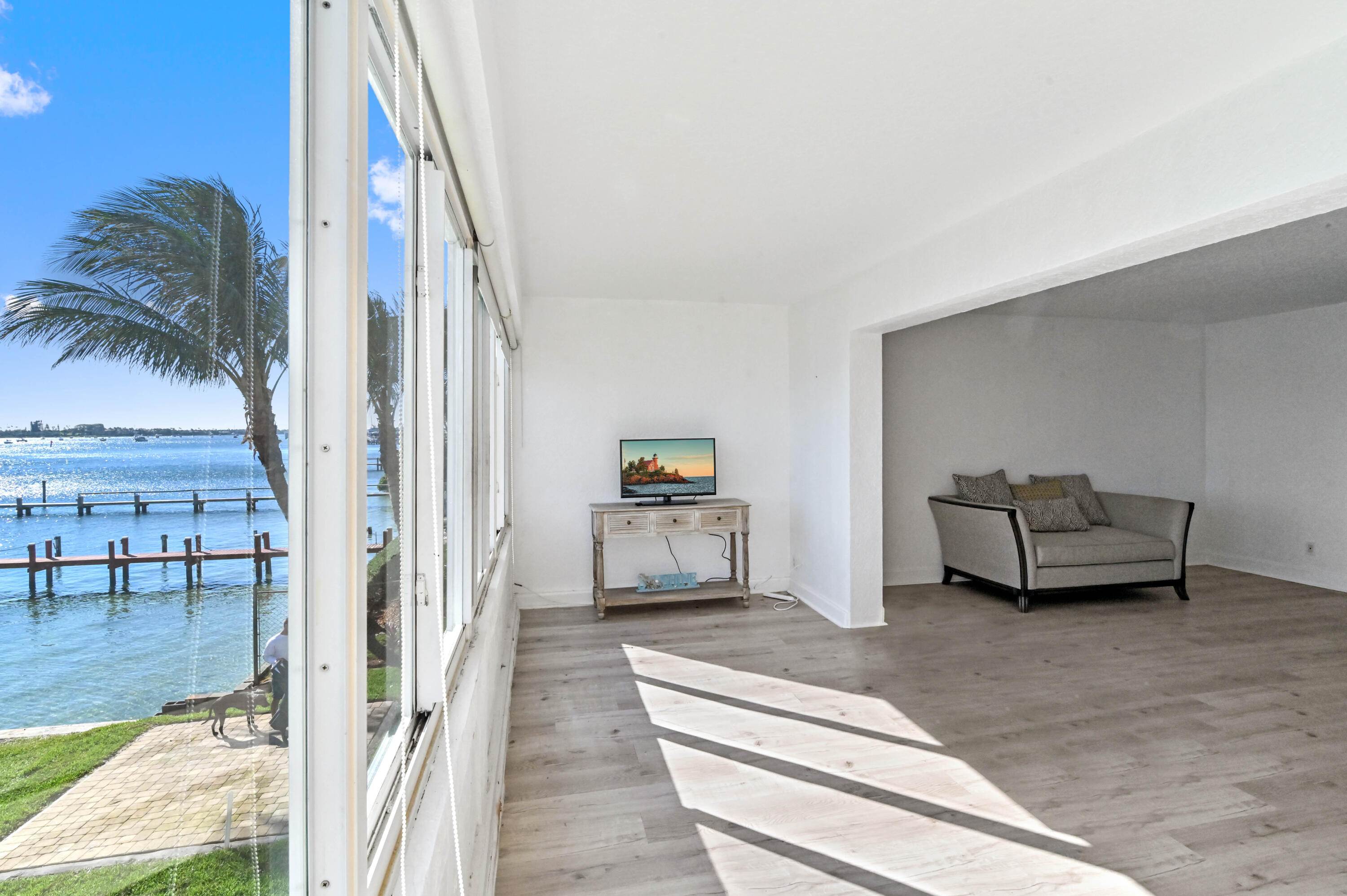 300 53rd Street, Unit 7 West Palm Beach, FL 33407 - Photo 8 of 24 a living room with furniture and a couch