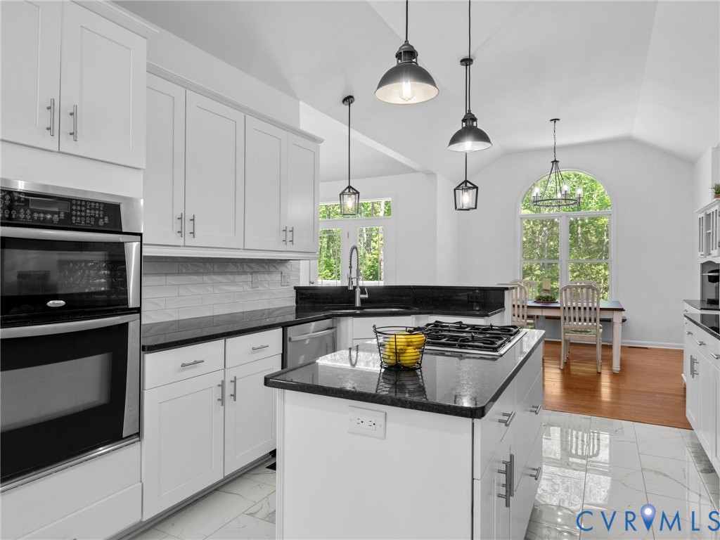 6126 Autumn Bluff Road Powhatan, VA 23139 - Photo 23 of 47 a kitchen with a sink a stove and cabinets