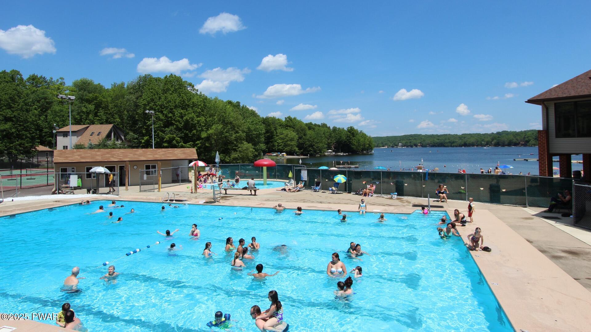 66 Boulder Road Lake Ariel, PA 18436 - Photo 41 of 51 a view of a swimming pool with lounge chairs