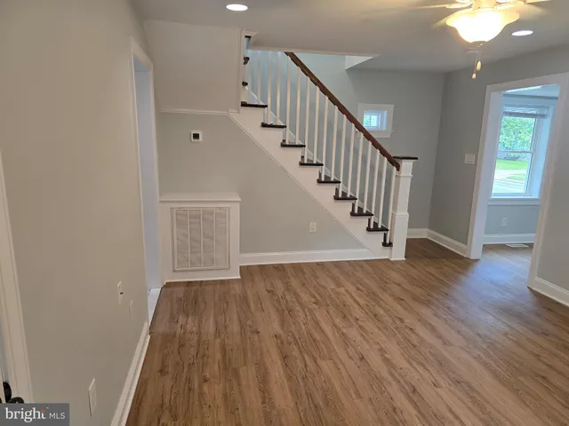 a view of an entryway with wooden floor