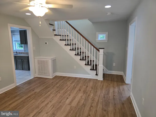 a view of a room with wooden floor