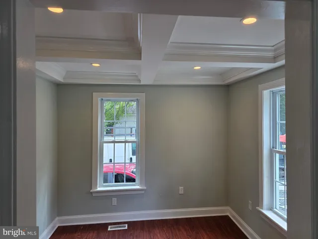 a view of a kitchen cabinets and wooden floor