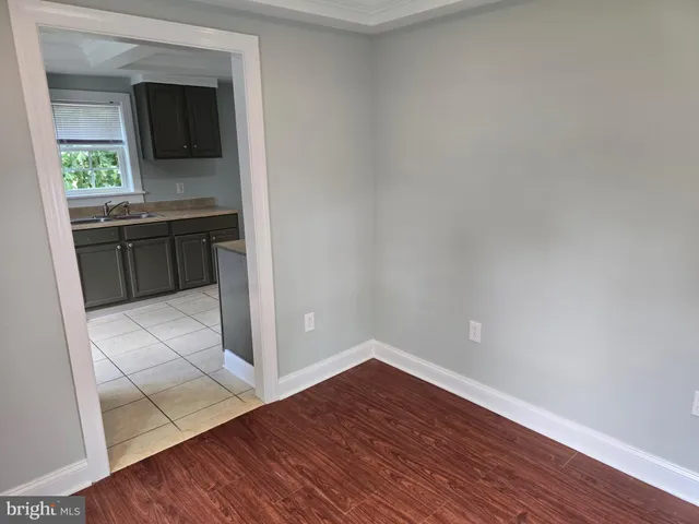 a view of front door with wooden floor