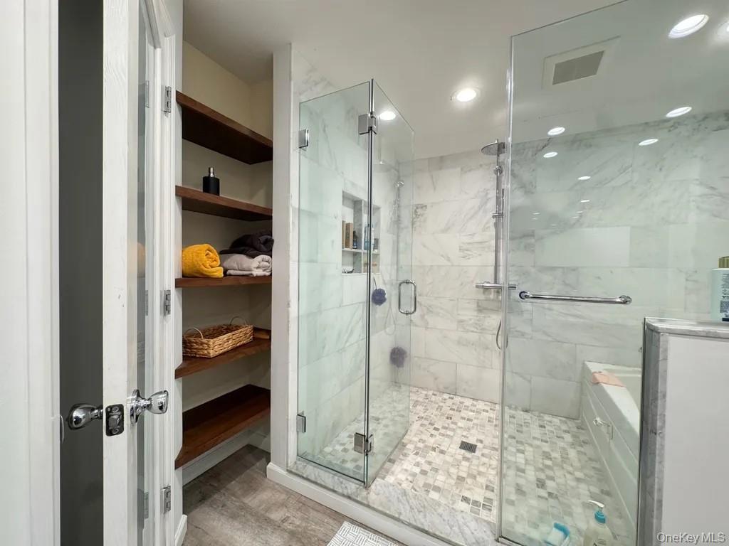 103 Sunflower Ridge Road Centereach, NY 11720 - Photo 13 of 16 a bathroom with a shower and a sink