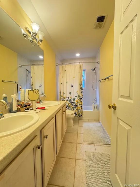 103 Sunflower Ridge Road Centereach, NY 11720 - Photo 14 of 16 a bathroom with a sink mirror and a shower