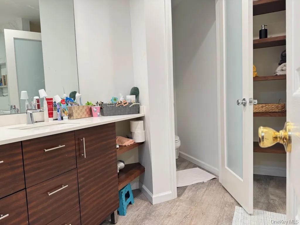 103 Sunflower Ridge Road Centereach, NY 11720 - Photo 15 of 16 a view of bathroom with a sink and mirror