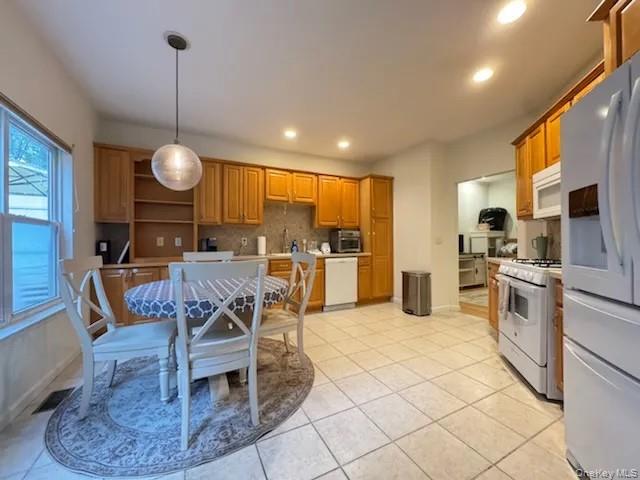 103 Sunflower Ridge Road Centereach, NY 11720 - Photo 16 of 16 a view of a dining room kitchen and a window