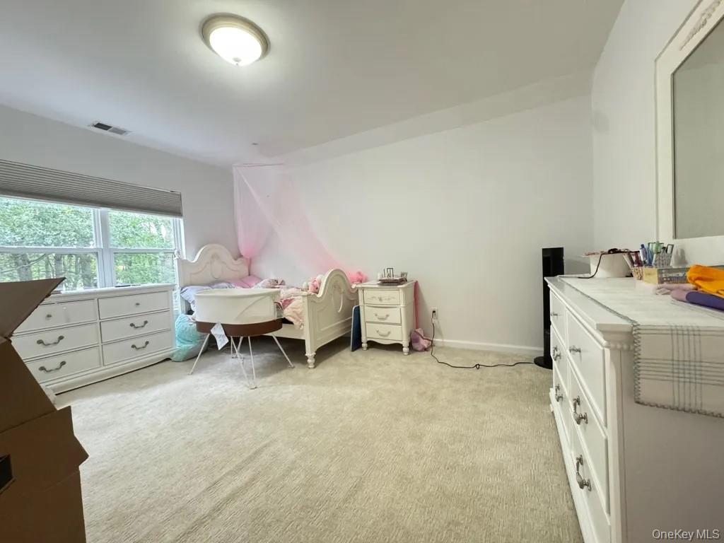103 Sunflower Ridge Road Centereach, NY 11720 - Photo 5 of 16 a living room with furniture and a gate