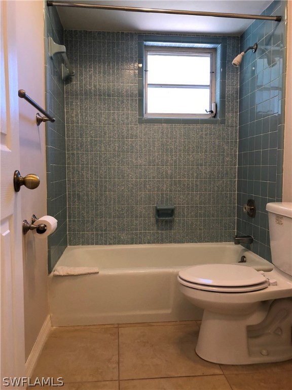 19 Connecticut Road Lehigh Acres, FL 33936 - Photo 11 of 26 a bathroom with a toilet and a shower