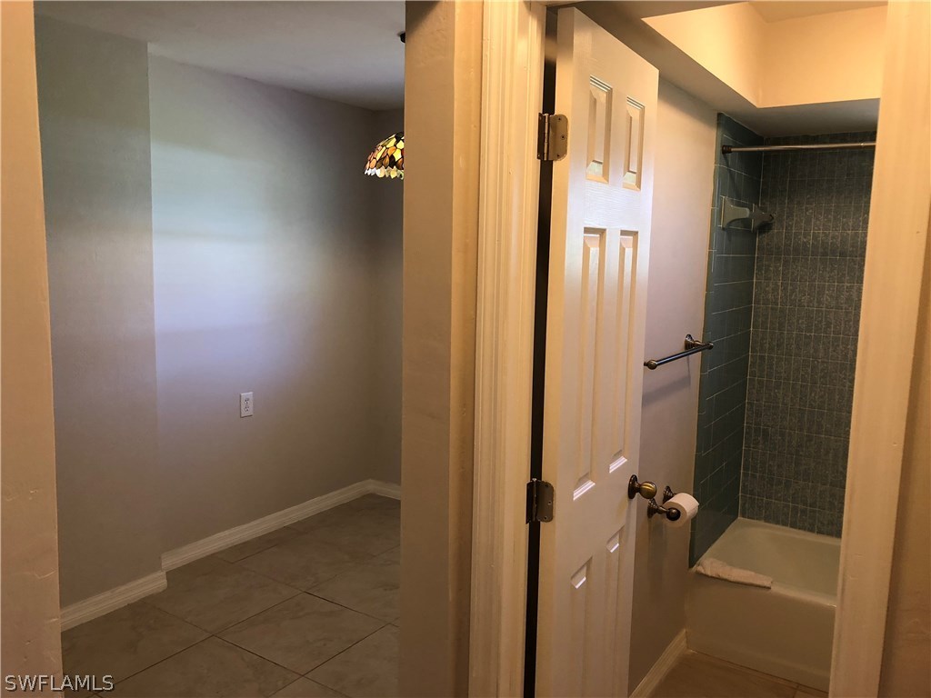 19 Connecticut Road Lehigh Acres, FL 33936 - Photo 17 of 26 an empty room with a door