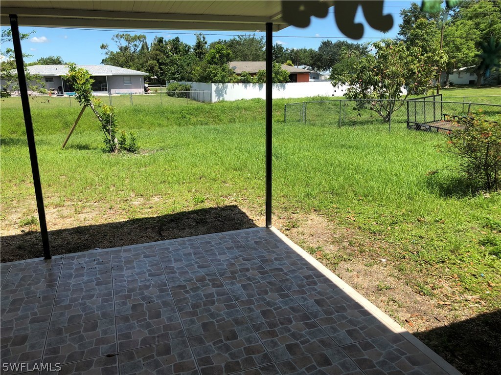 19 Connecticut Road Lehigh Acres, FL 33936 - Photo 23 of 26 a view of a yard with potted plants
