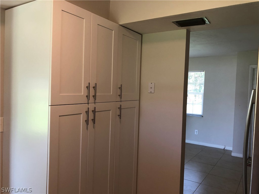 19 Connecticut Road Lehigh Acres, FL 33936 - Photo 7 of 26 a view of a closet area