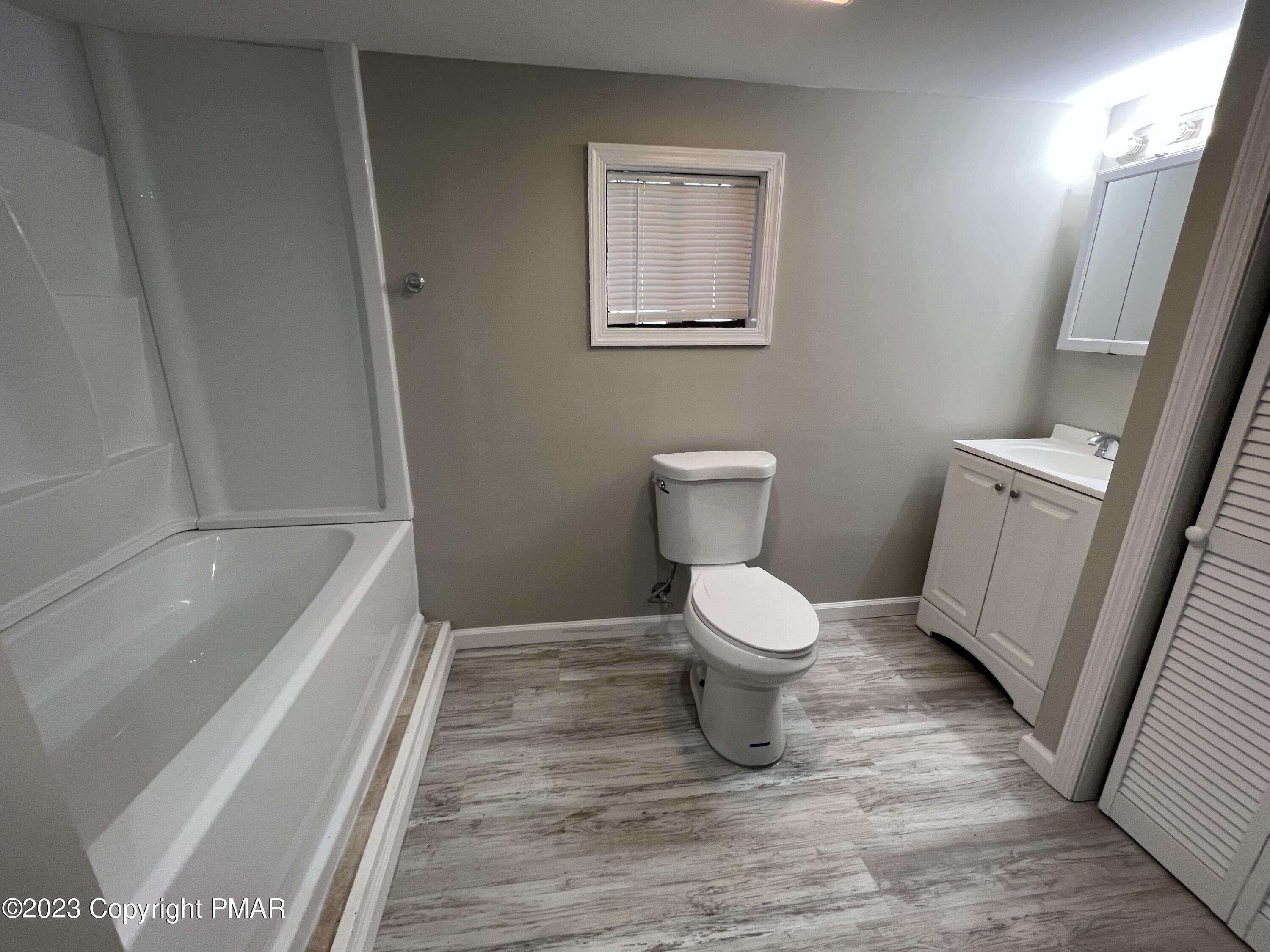 143 Granite Road Long Pond, PA 18334 - Photo 11 of 23 a bathroom with a toilet and a bathtub