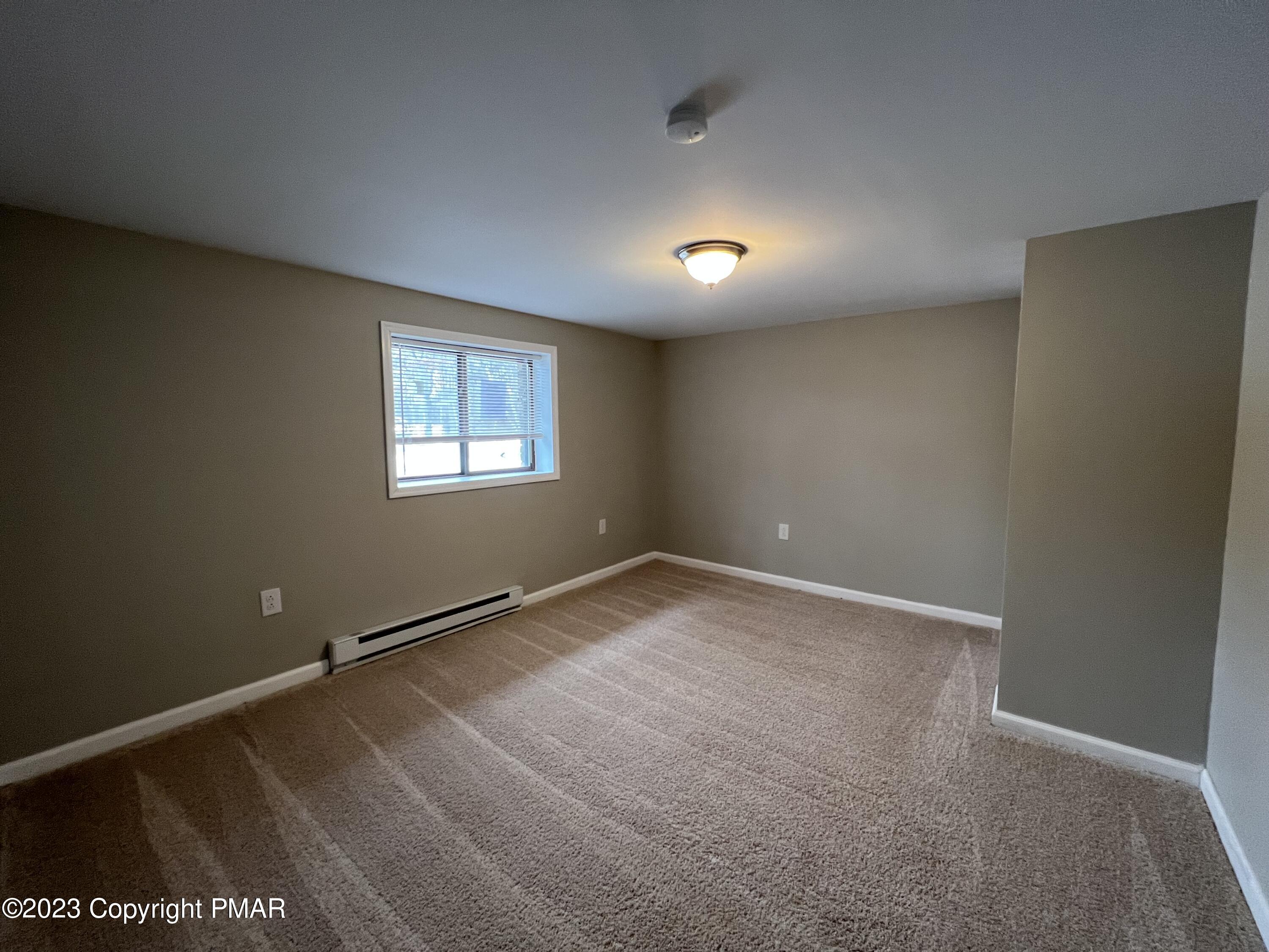 143 Granite Road Long Pond, PA 18334 - Photo 7 of 23 an empty room with windows