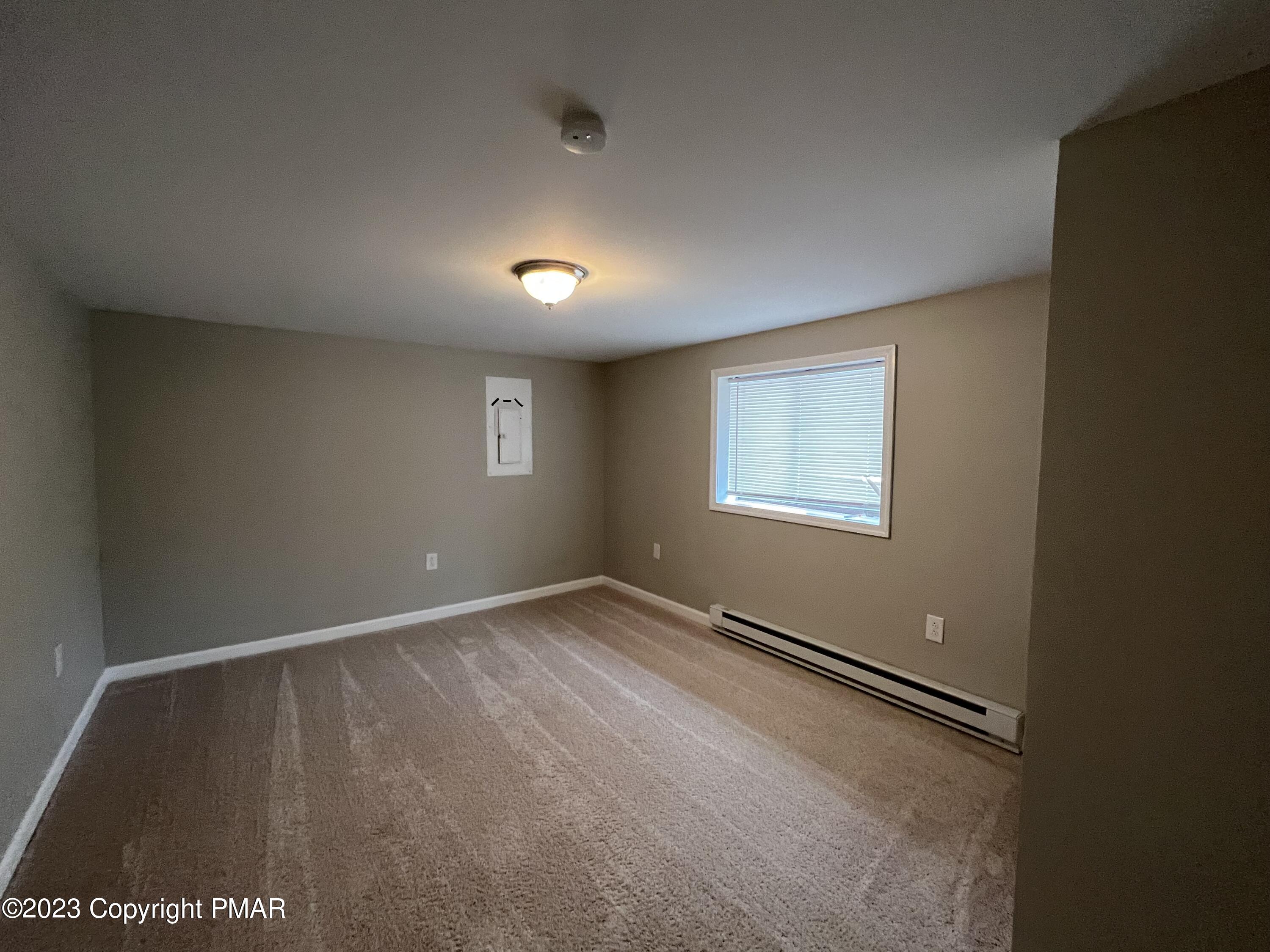 143 Granite Road Long Pond, PA 18334 - Photo 8 of 23 an empty room with windows