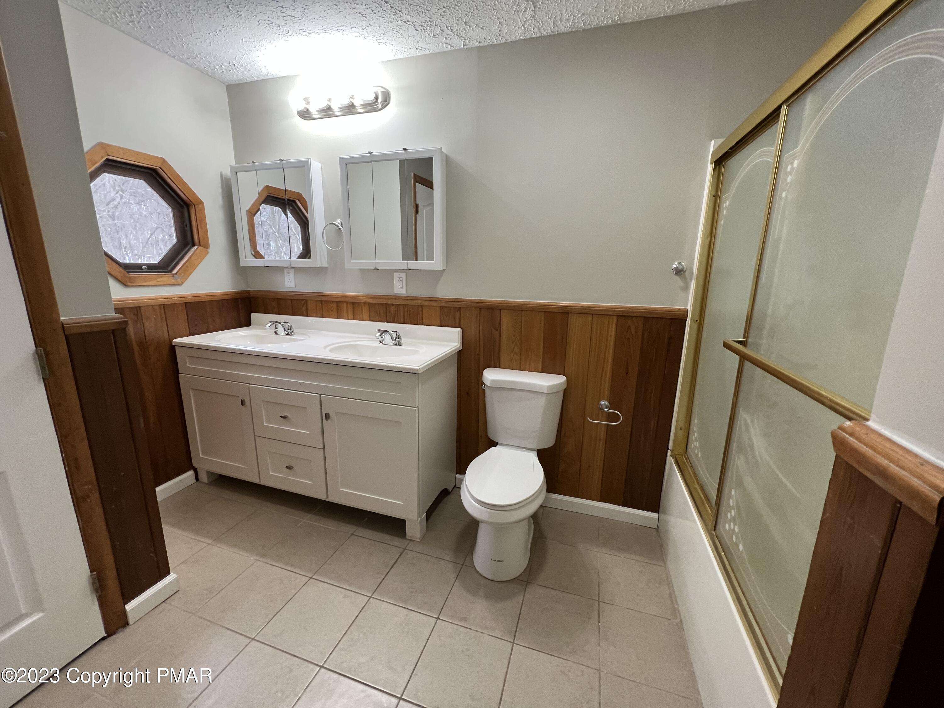 143 Granite Road Long Pond, PA 18334 - Photo 9 of 23 a bathroom with a toilet sink vanity granite and mirror