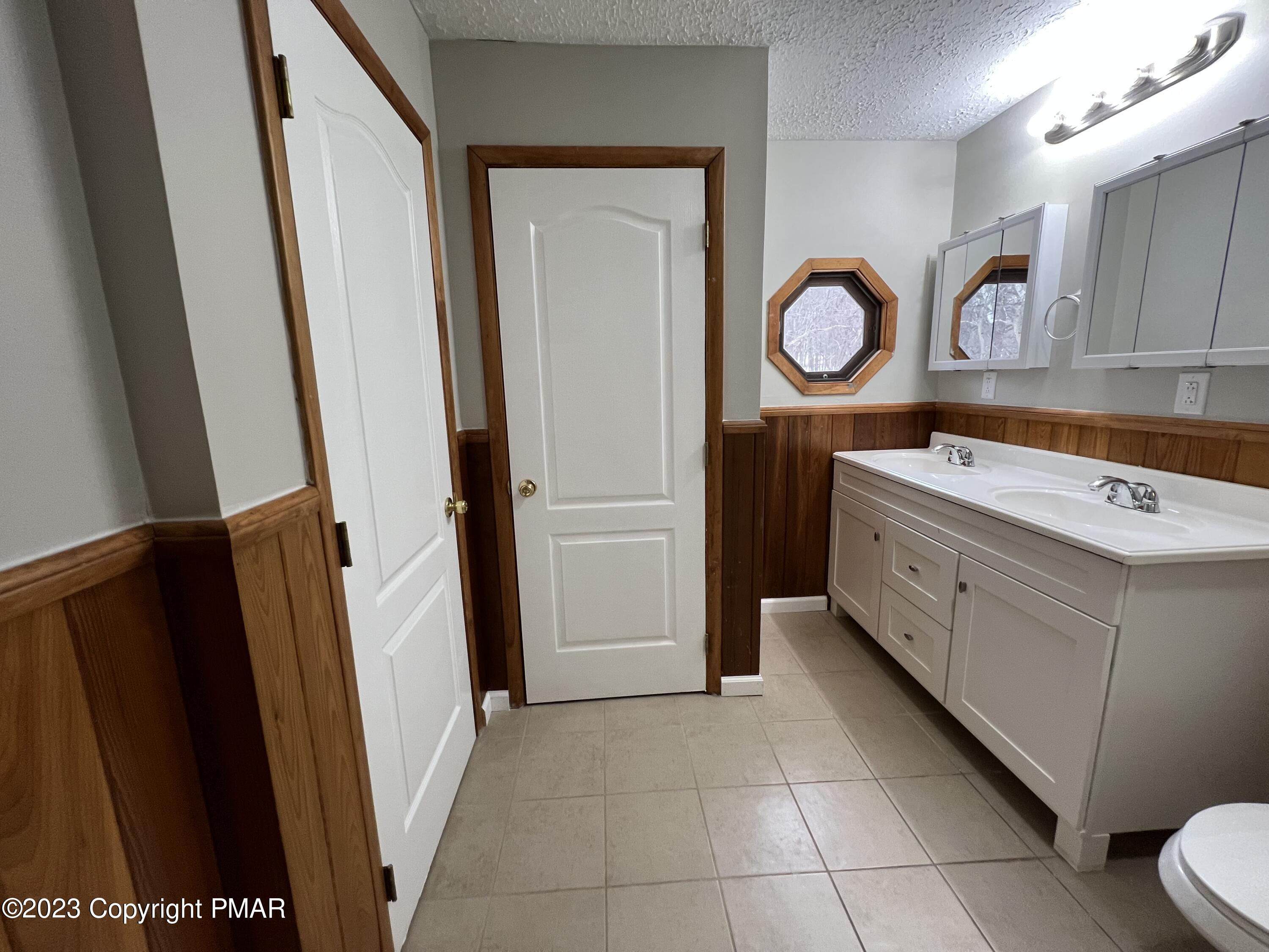 143 Granite Road Long Pond, PA 18334 - Photo 10 of 23 a kitchen with a refrigerator and a stove