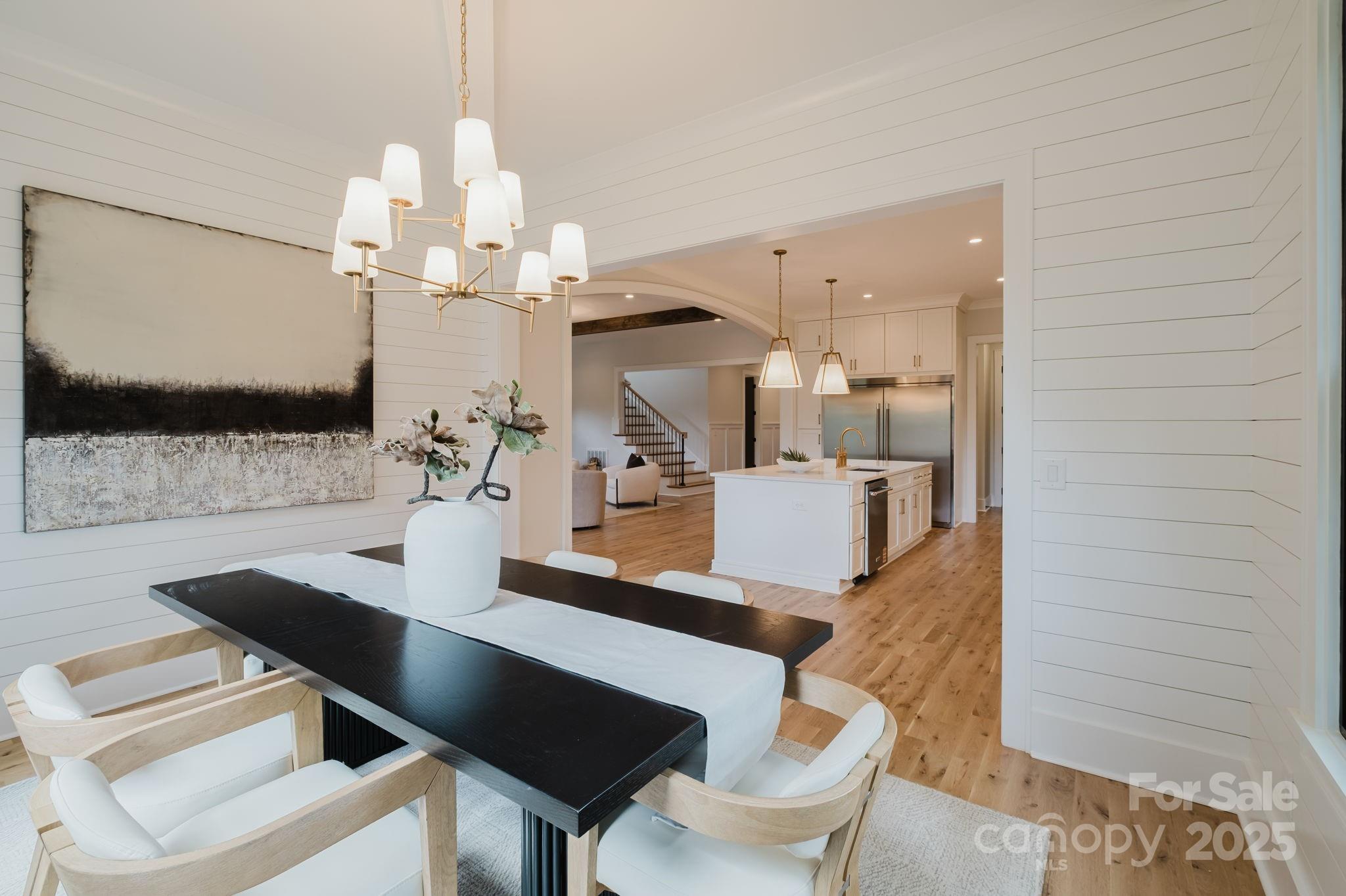 1625 Club Road Charlotte, NC 28205 - Photo 11 of 31 a dining room with furniture and wooden floor