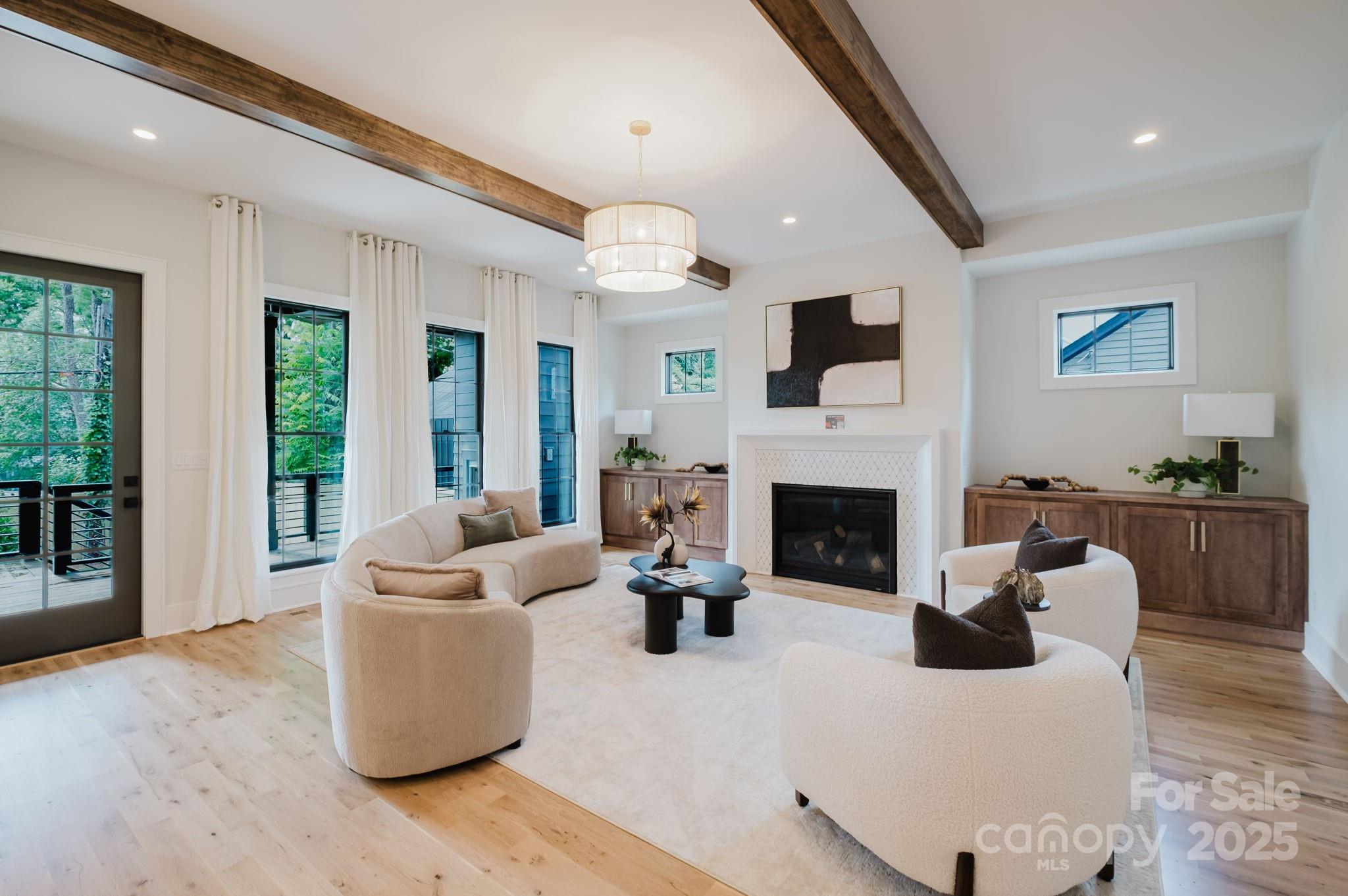 1625 Club Road Charlotte, NC 28205 - Photo 14 of 31 a living room with furniture a fireplace and a flat screen tv