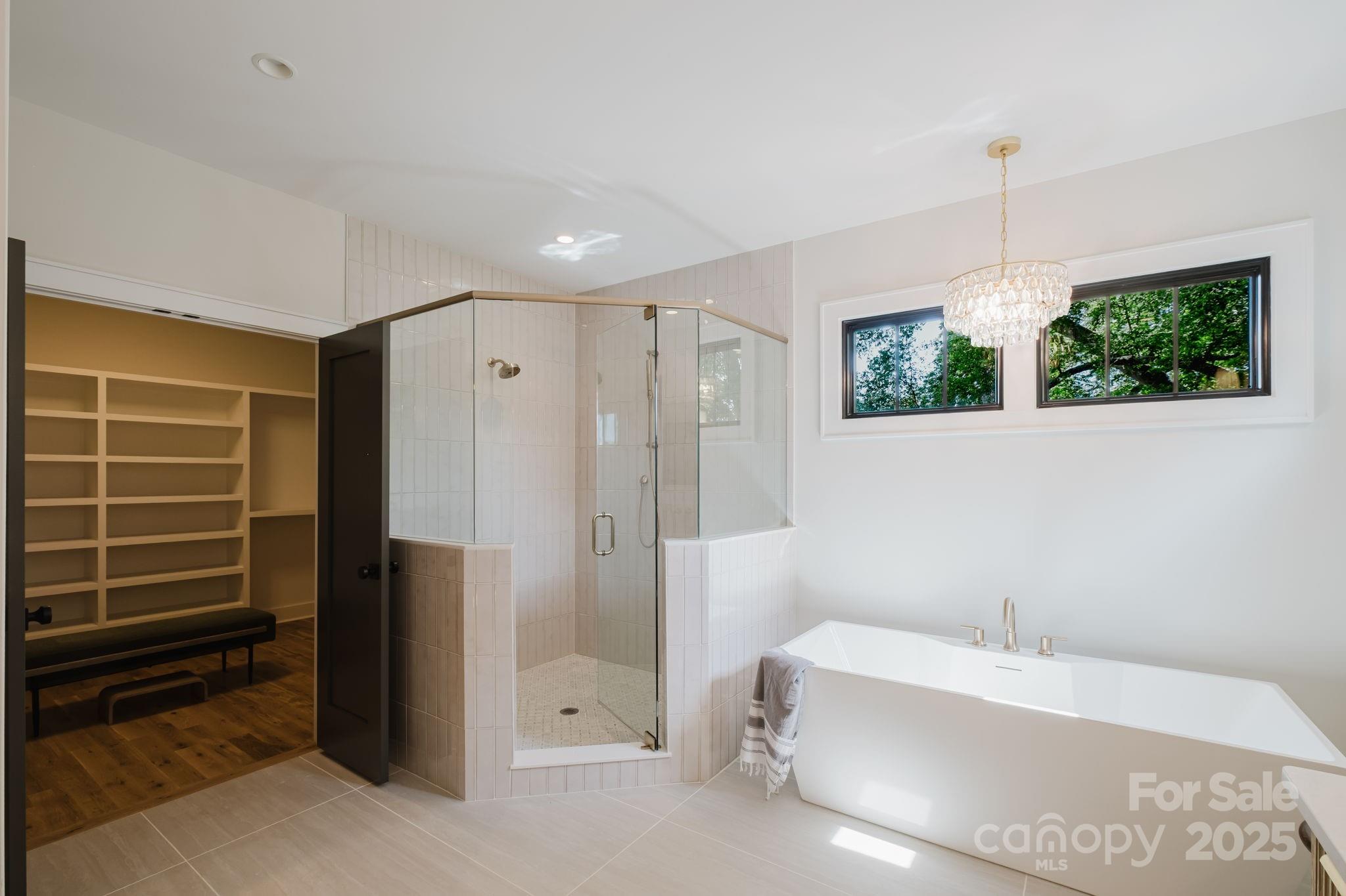 1625 Club Road Charlotte, NC 28205 - Photo 17 of 31 a bathroom with a tub sink and shower