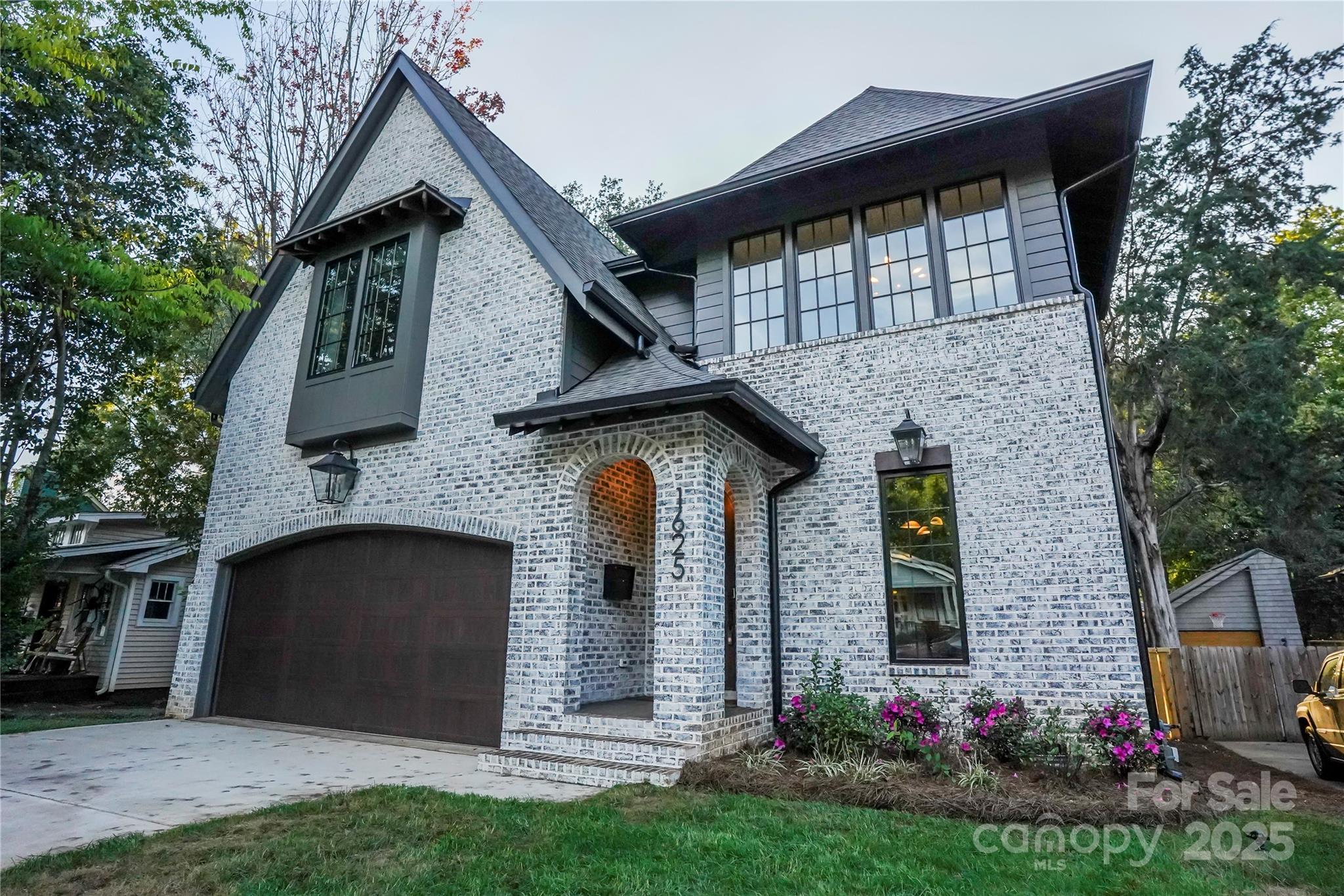 1625 Club Road Charlotte, NC 28205 - Photo 2 of 31 a front view of a house with a garden