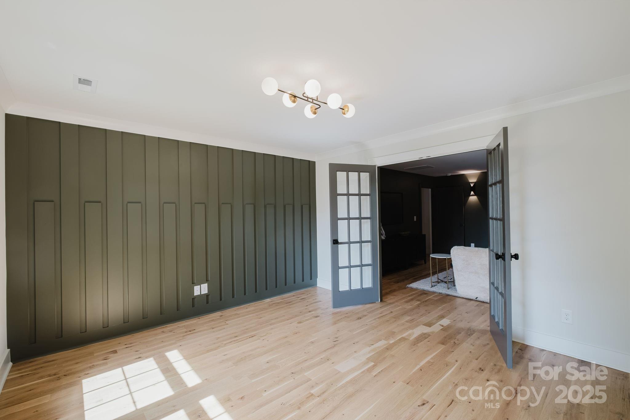 1625 Club Road Charlotte, NC 28205 - Photo 26 of 31 a view of entryway with wooden floor and bedroom
