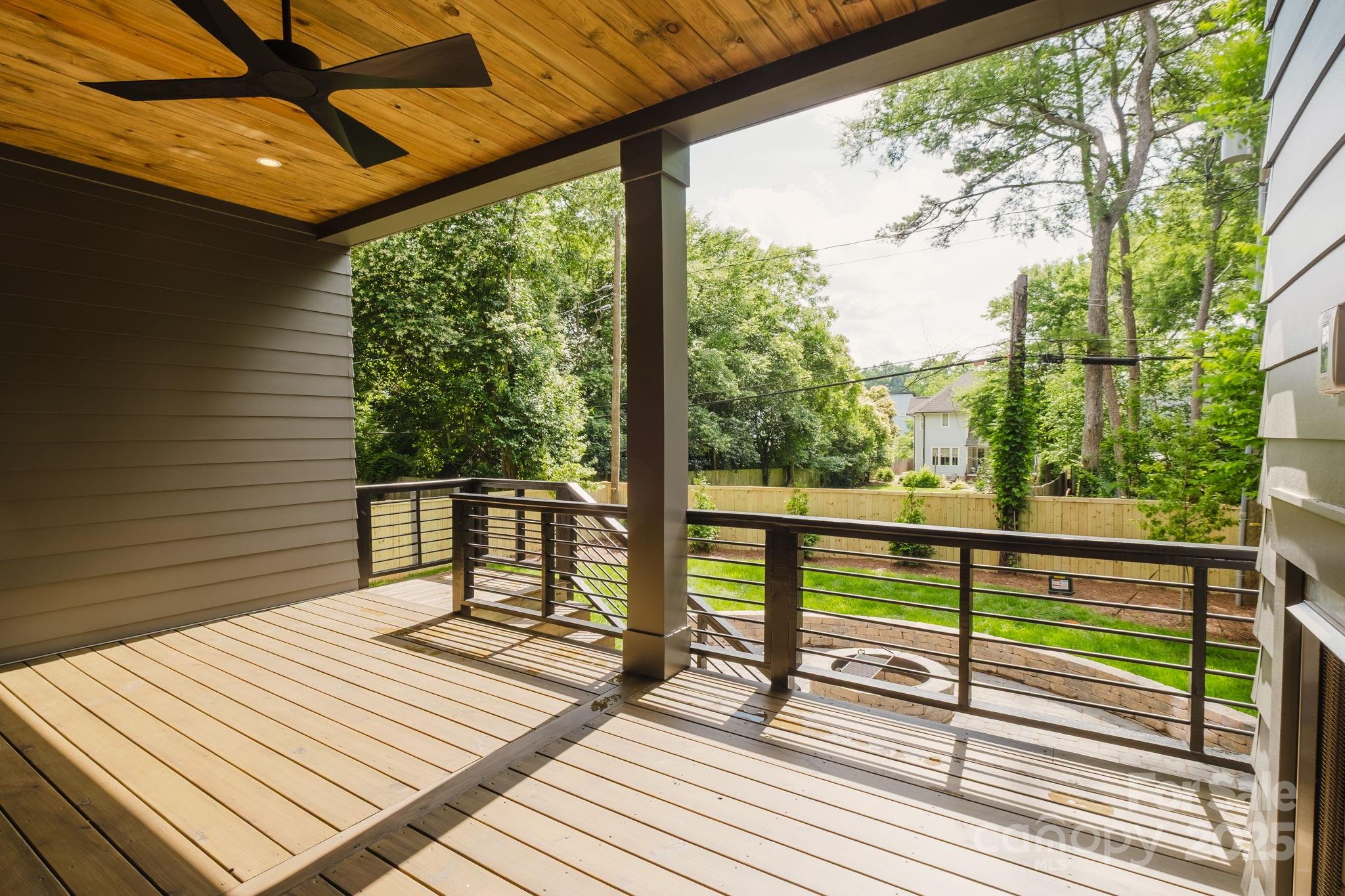 1625 Club Road Charlotte, NC 28205 - Photo 27 of 31 a view of a balcony with wooden floor and bench