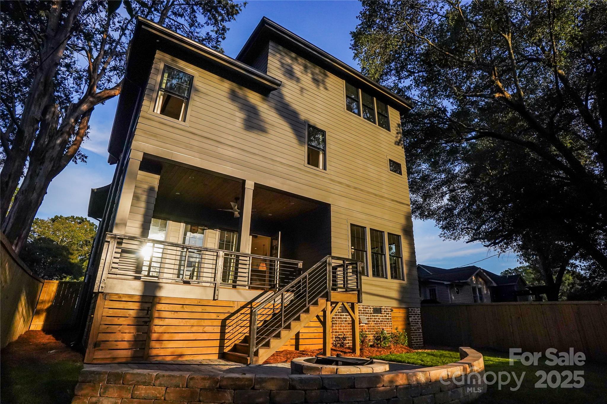 1625 Club Road Charlotte, NC 28205 - Photo 29 of 31 a view of a house with a wooden fence