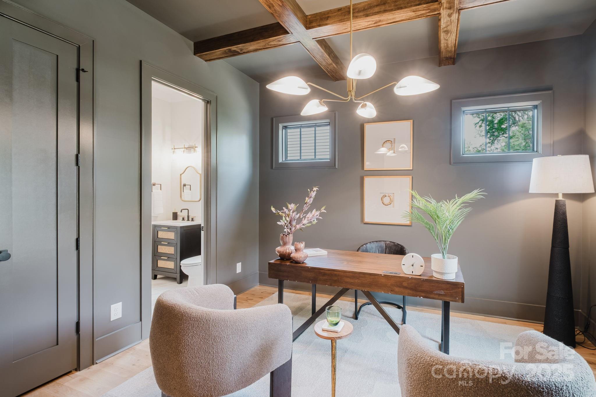 1625 Club Road Charlotte, NC 28205 - Photo 4 of 31 a living room with furniture and a potted plant
