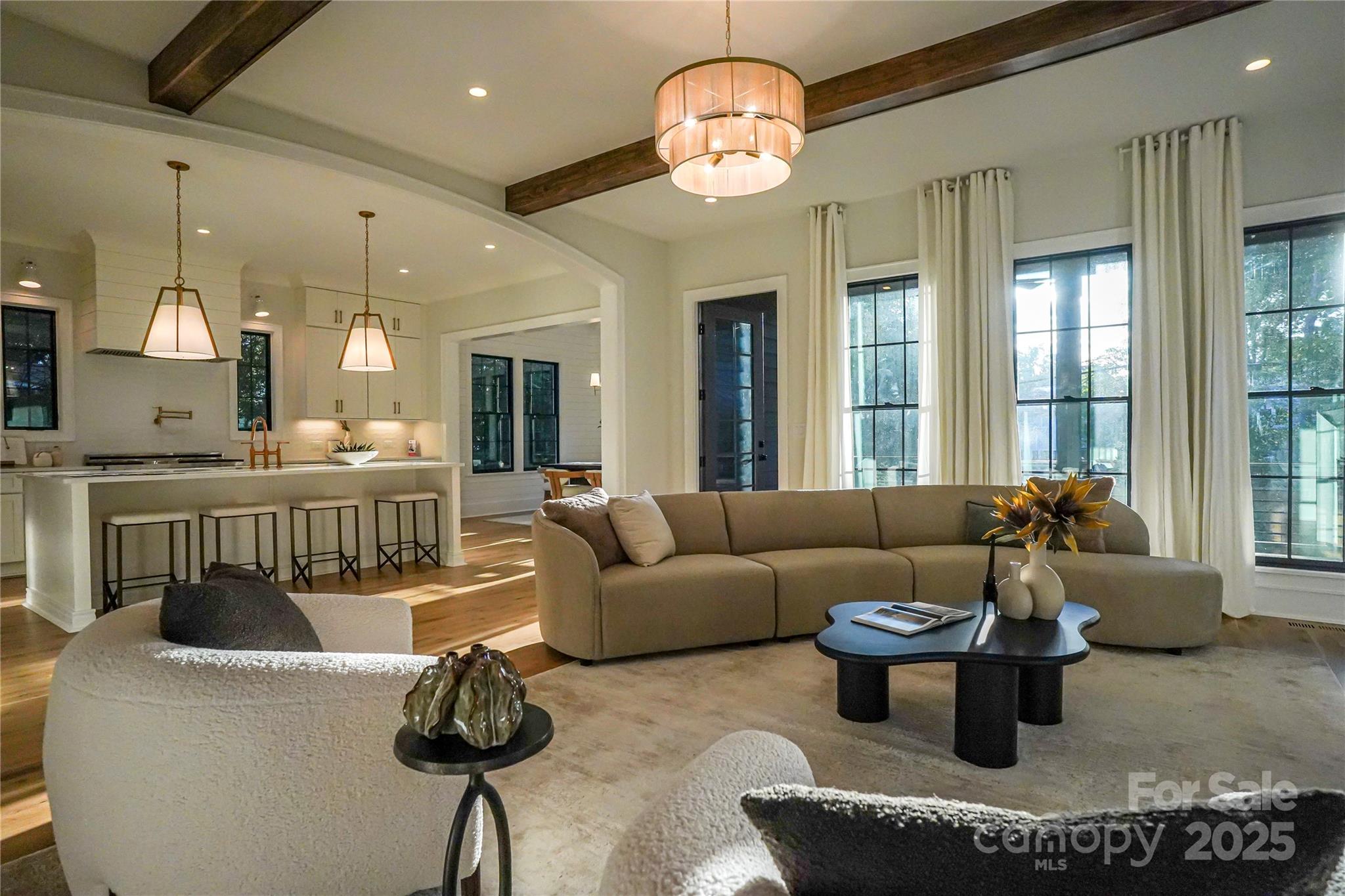 1625 Club Road Charlotte, NC 28205 - Photo 8 of 31 a living room with furniture a dining table and a large window