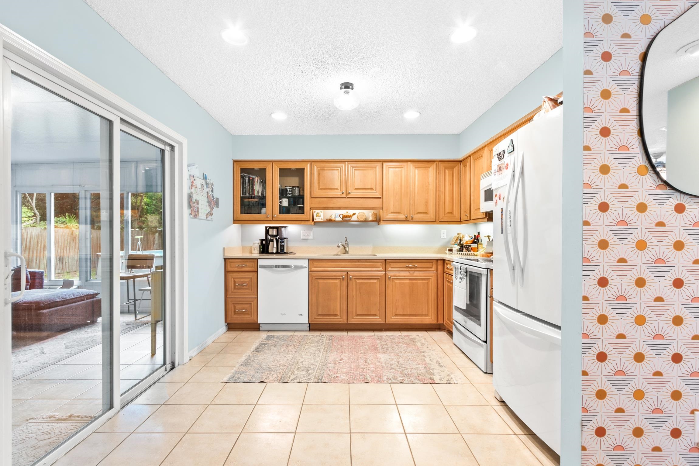 359 Shamrock Road St. Augustine, FL 32086 - Photo 11 of 39 a kitchen with a stove a sink and a refrigerator