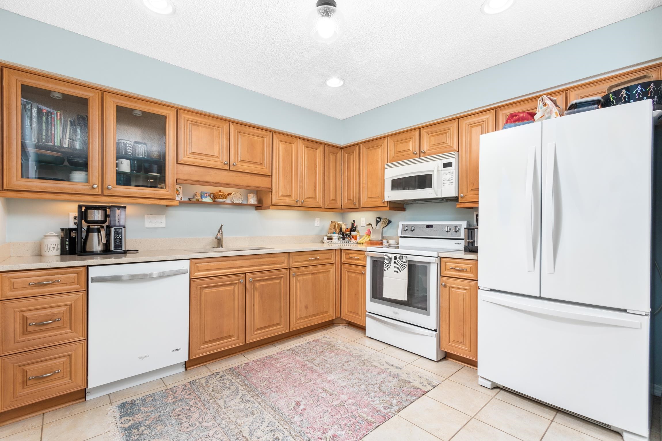 359 Shamrock Road St. Augustine, FL 32086 - Photo 12 of 39 a kitchen with white cabinets and white appliances