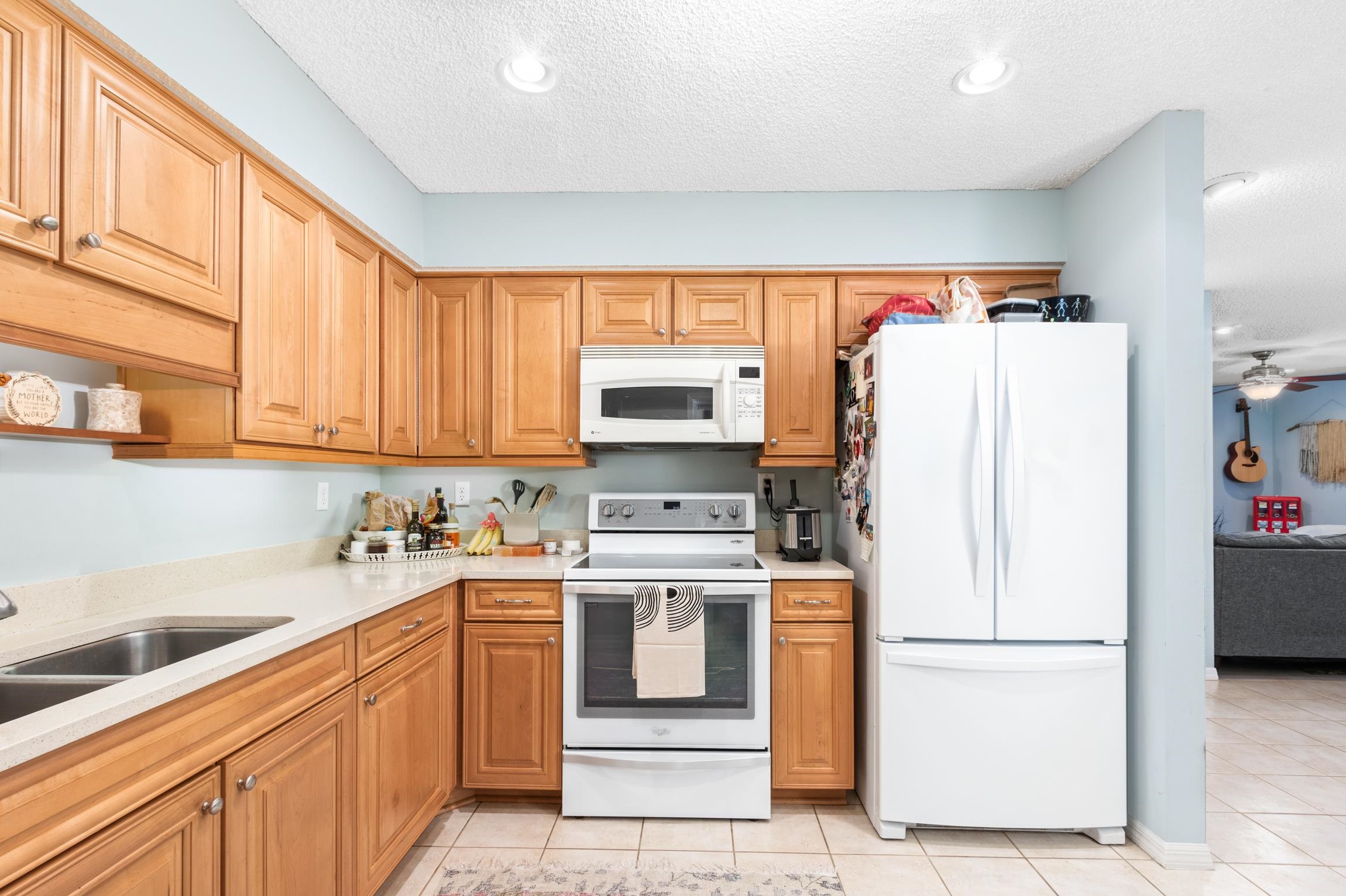 359 Shamrock Road St. Augustine, FL 32086 - Photo 13 of 39 a kitchen with a white cabinets and white appliances